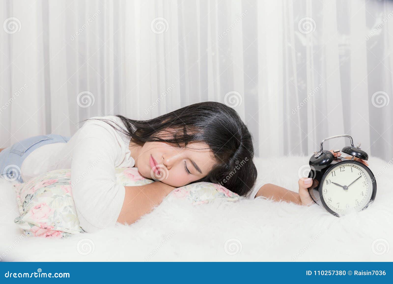 woman sleep on the living room and early wake up at ten oÃ¢â¬â¢clock.